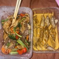 Veggie beef fried noodles (half eaten) and chicken satay skewers  at Tian Ci Vegan in Darlington