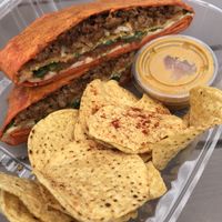 Vegan crunch wrap supreme from Vegan Vibrationz at Dallas Farmers Market in Dallas