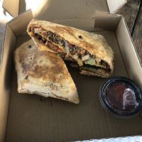 Pizza crunch wrap from Bam’s Vegan at Dallas Farmers Market in Dallas