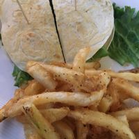 Impossible quesadilla burger with in house vegan bacon and crack pepper fries.   at Blondie's in Flint