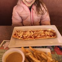 Kids vegan flat bread pizza with crack pepper fries and cheeze sauce to dip. I had a very happy vegan girl.  at Blondie's in Flint