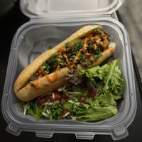 Jackfruit steak bomb and side salad at Juuuicy's Vegan Restaurant & Mama's Vegan Cocina in West Palm Beach
