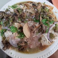 Chilaquiles divorciados morita/verdes con champiñones y nopales at Panza Llena Corazón Contento in San Jose Del Cabo