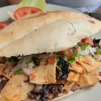 Chilaquiles torta at Panza Llena Corazón Contento in San Jose Del Cabo