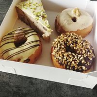 Banana cake, walnut doughnut, banana doughnut and chocolate doughnut - all so good! at Croissy in Deinze