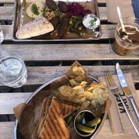 Falafel salad (top) and hummus toast with marinated tempeh (bottom) + iced latte with oat milk   at Kafé Magasinet in Gothenburg