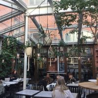 Cute and cozy green house patio at Kafé Magasinet in Gothenburg