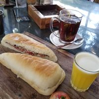 The Artjuna breakfast with oriental sandwich without egg, pineapple juice, and lemongrass tea. at Artjuna in Anjuna