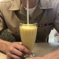 Peach 🍑 mango 🥭 vegan smoothie yummy yummy!!! at Townee Square in Libertyville