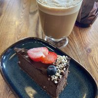 Chocolate raw cake (sugar free, gluten free) with (decaf) latte  at VegB12 in Tallinn