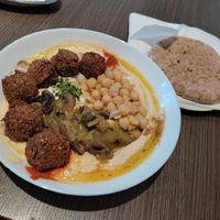 Amazing hearthy vegan hummus bowl with homemade falafels.  at Hummusbar in Sofia