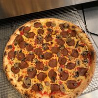 Naturally leavened sourdough crust with tomato sauce, house made cashew mozzarella, East Village PDX vegan roni and roasted mushrooms at Scottie's Pizza Parlor in Portland