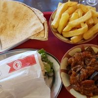Falafel sandwich, moussaka, French fries and Lebanese flat breat at La Perle du Liban in Caen