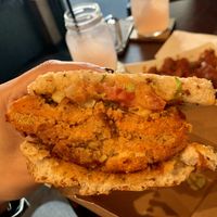 Half of spicy chick’n sandwich  at Wisdom's Vegan Bakery & Cafe in Spring