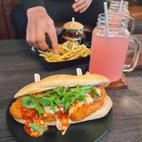 I got the Chick’n Parm Sub. (10/10) He got the BBQ Pulled Sandwhich (actually my favorite.) and some Parm fries which are always amazing. Two lemonades. ♥️😁  at Wisdom's Vegan Bakery & Cafe in Spring