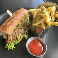 Philly and garlic/ Parmesan fries   at Wisdom's Vegan Bakery & Cafe in Spring