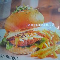 fraudulent photo in the store window of how the chicken sandwich is supposed to be  at The Vegan Chef - Midrand in Johannesburg