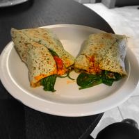 New all day breakfast vegan wrap (tofu scramble, chipotle beans, mushroom, tomatoes, spinach) served hot! at Starbucks in Northampton