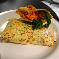 New all day breakfast vegan wrap (tofu scramble, chipotle beans, mushroom, tomatoes, spinach) served hot! at Starbucks in Northampton