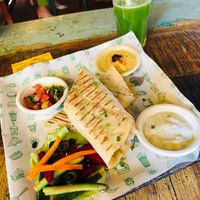 The falafel wrap with hummus, salad, tziki, and salsa. Delicious!  at Step Out Cafe in Jaipur