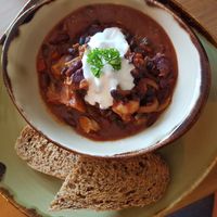 Black bean and jackfruit stew with homemade bread at Va Va Vegan in Amersham
