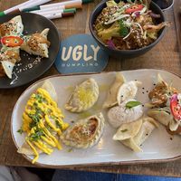 Gf spinach & tofu dumplings (left); gf ugly noodles (right); veggie platter (front)  at Ugly Dumpling in London