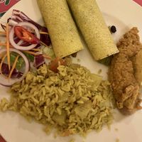 Enchiladas (two corn tortillas filled with black beans and mixed veg, served with rice and refried beans).  at Dos Sombreros in Brighton