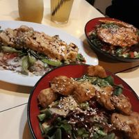 Front vegan chicken poke bowl and left is vegan wok with tofu at Pho House in Berlin