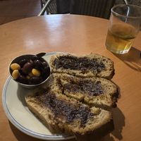 Starter bread, olives, and lupine. House kombucha was so good!  at Casa da Horta in Porto