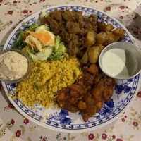 Hummus, salad, couscous, chickpea/tomatoes, potatoes, soy ground “meat”, and a garlic sauce at Casa da Horta in Porto