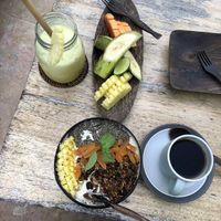 Pineapple juice, smoothie bowl, fruit plate  at Flowers & Fire in 