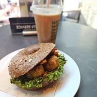 Falafel bagel, oat iced latte at Coffee Fellows - Alexanderplatz in Berlin