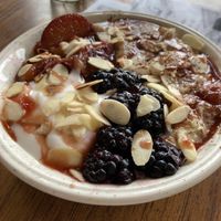 Cardamom porridge with nut butter, fruit & almonds at Wild Thing in Cardiff
