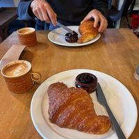 Croissant with jam and oat flat white   at Wild Thing in Cardiff
