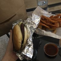 Vegan Moo less burger with cheese and sweet potato fries and onion rings  at BRGR in Edinburgh