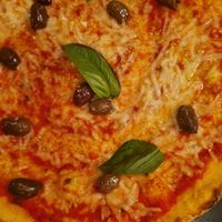 Vegan cheese pizza with added olives! at Olivia Aker Brygge in Oslo