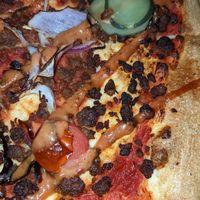 Burnt and dry toppings on the royale pizza. at Crust Gourmet Pizza Bar in Richmond