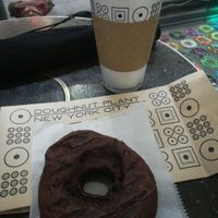 Vegan dark chocolate donut and coffee at Doughnut Plant - Hotel Chelsea in New York City