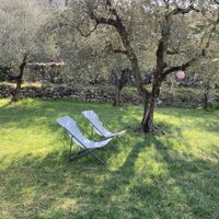 Lounge chairs to enjoy the garden  at Da La Babi in Arco