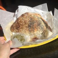Mushroom, potatoes and onions pastry served with tahini, chili oil, and pickles at Frena Bakery and Café - Richmond in San Francisco