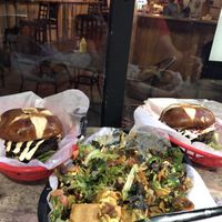 From left to right- Thee evolve smash burger, nachos (partially devoured) and the crack burger at Evolve Modern Vegan Kitchen in Daytona Beach