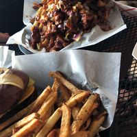 Evolve kids burger with fries and BBQ jackfruit fries  at Evolve Modern Vegan Kitchen in Daytona Beach