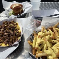 Philly Mac and cheese with cheesy fries and chick’n sandwich  at Evolve Modern Vegan Kitchen in Daytona Beach