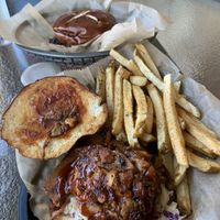 Foreground: dog with jackfruit bbq.  Note the soft pretzel bun in background.  Served with a crunchy, healthy slaw. at Evolve Modern Vegan Kitchen in Daytona Beach