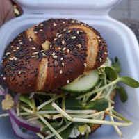 Bagel with almond cream cheese, sprouts, hummus & cucumbers at Coco's Cafe in Jasper