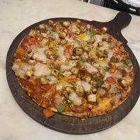 Tofu pizza , slightly spicy bc of jalapeños   at Earth Cafe @ Waterfield in Mumbai