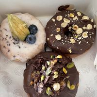 Chocolate hazelnut, chocolate crunchy, lemon and poppy seed donuts. at COCO Donuts in Brussels
