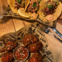 Buffalo coli wings and taco trio! So good!  at Mad Mad Vegan - Chueca in Madrid