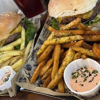 The Mad Signature Burger with cajun fries  at Mad Mad Vegan - Chueca in Madrid