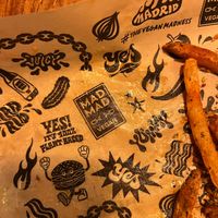 A lot of attention to detail — even the paper used under food has the restaurant‘s design. at Mad Mad Vegan - Chueca in Madrid